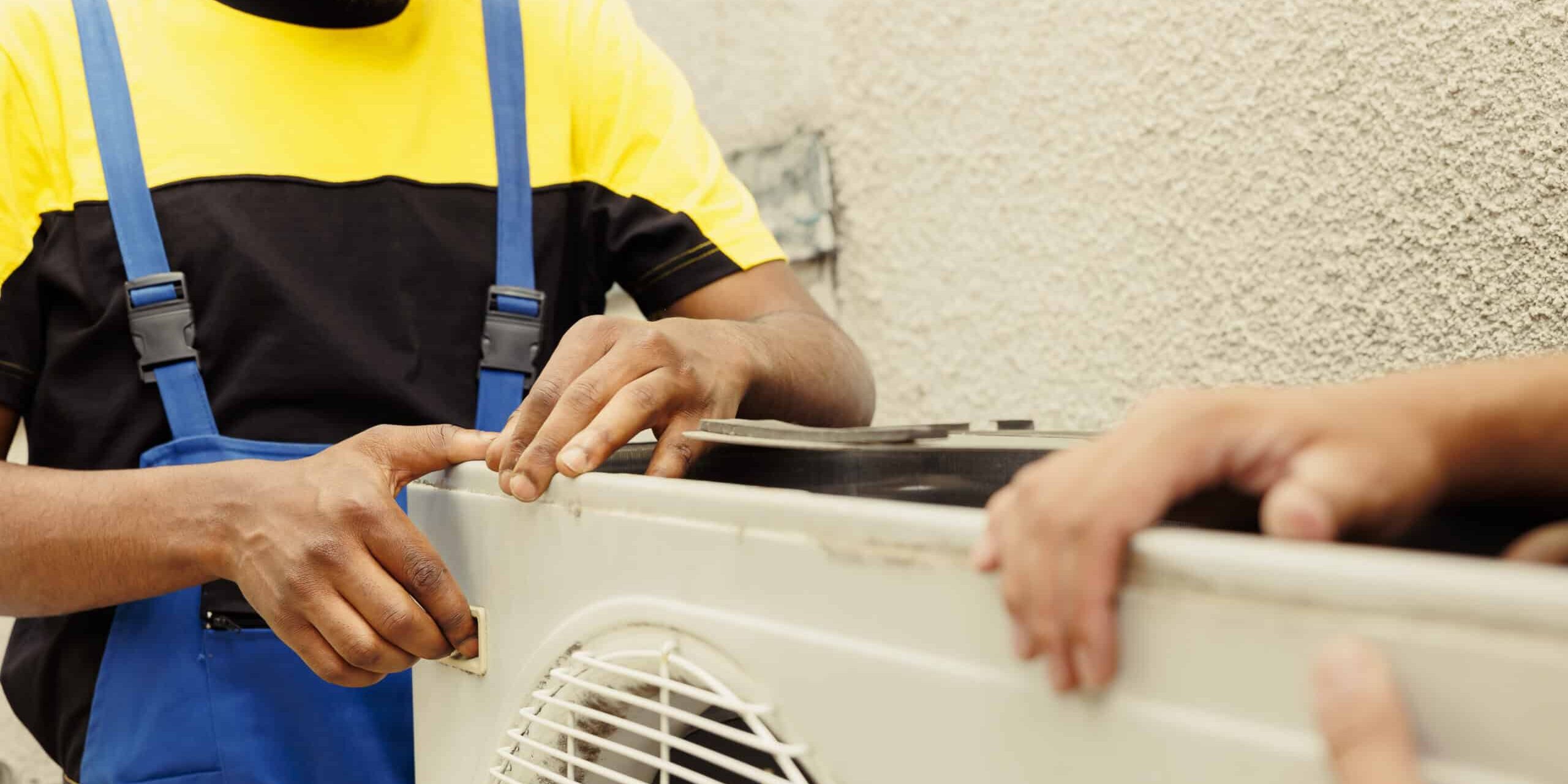 Engineers opening up faulty hvac system Air Duct Cleaning In Toronto